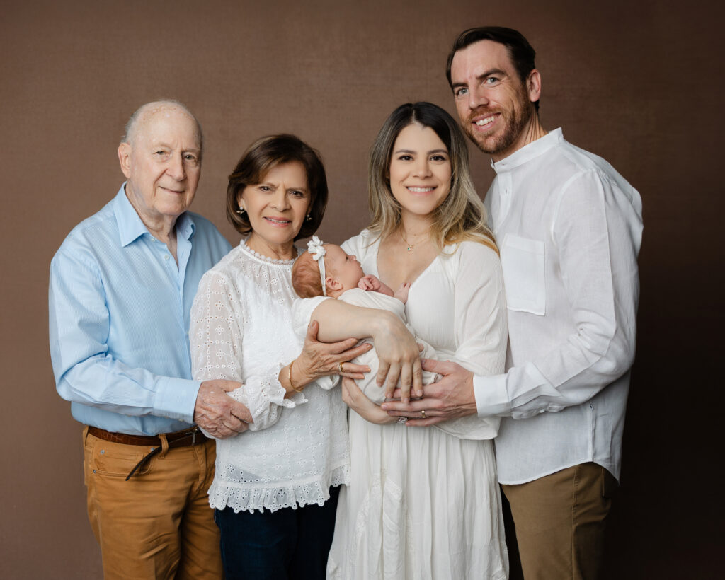 Three generations of fathers and children posing together for a family portrait in the Inland Empire