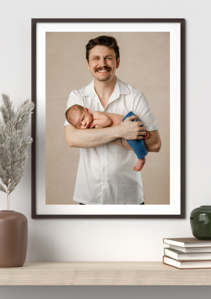 Father and baby portrait printed as wall art in an Inland Empire home
