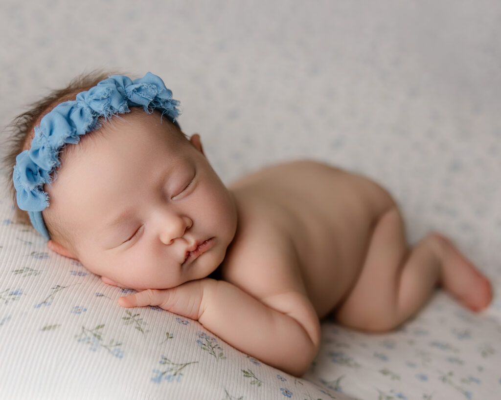 Newborn sleeping soundly during breastfeeding support in early motherhood, reflecting safety and nurturing connection.