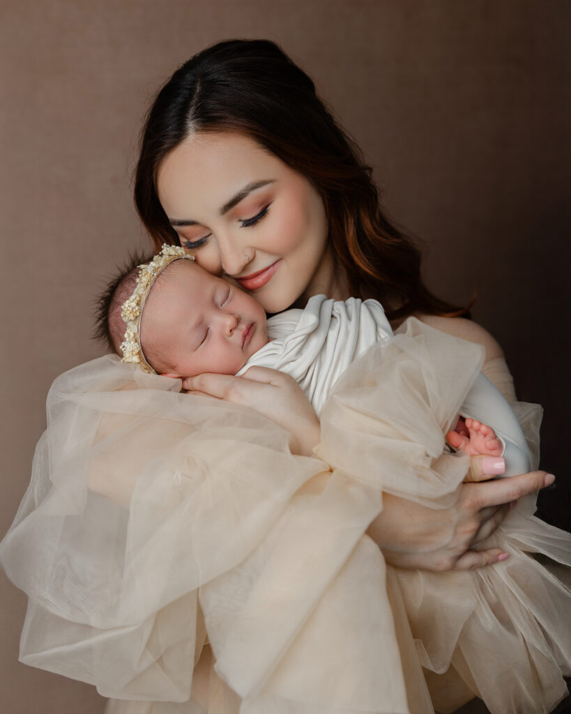 Quiet bonding moment during breastfeeding support in early motherhood, with mother holding her newborn in soft natural light.