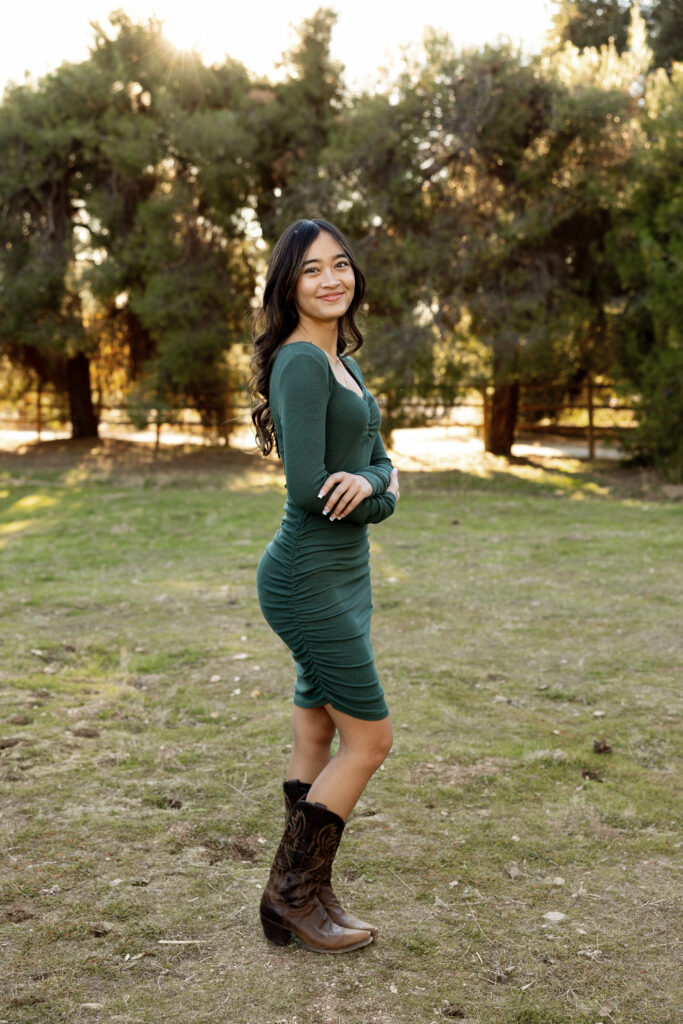 Senior girl posing during outdoor senior photo session by Kaitlyn Dawn Photography.