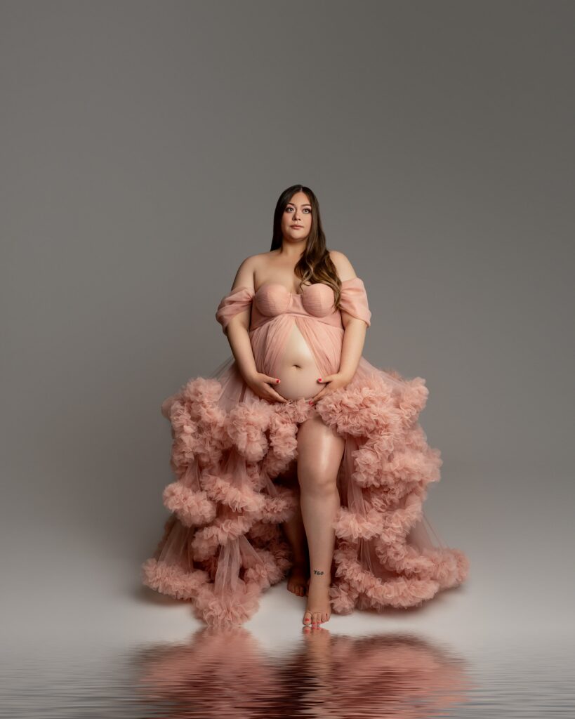 Studio maternity portrait of expecting mother in blush gown, photographed by Beaumont and Inland Empire maternity photographer Kaitlyn Dawn Photography.